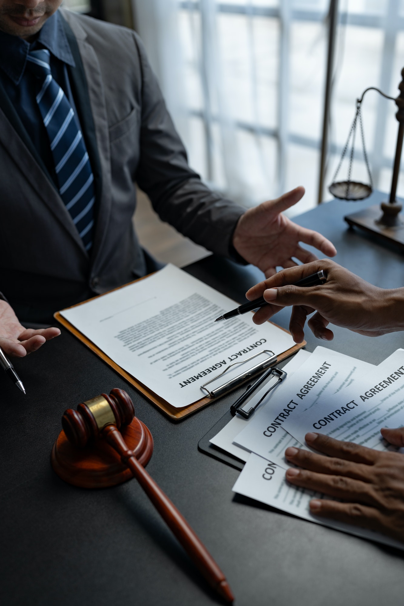 attorneys-or-lawyer-reading-statute-of-limitations-consulting-between-male-lawyers-and-business-cli